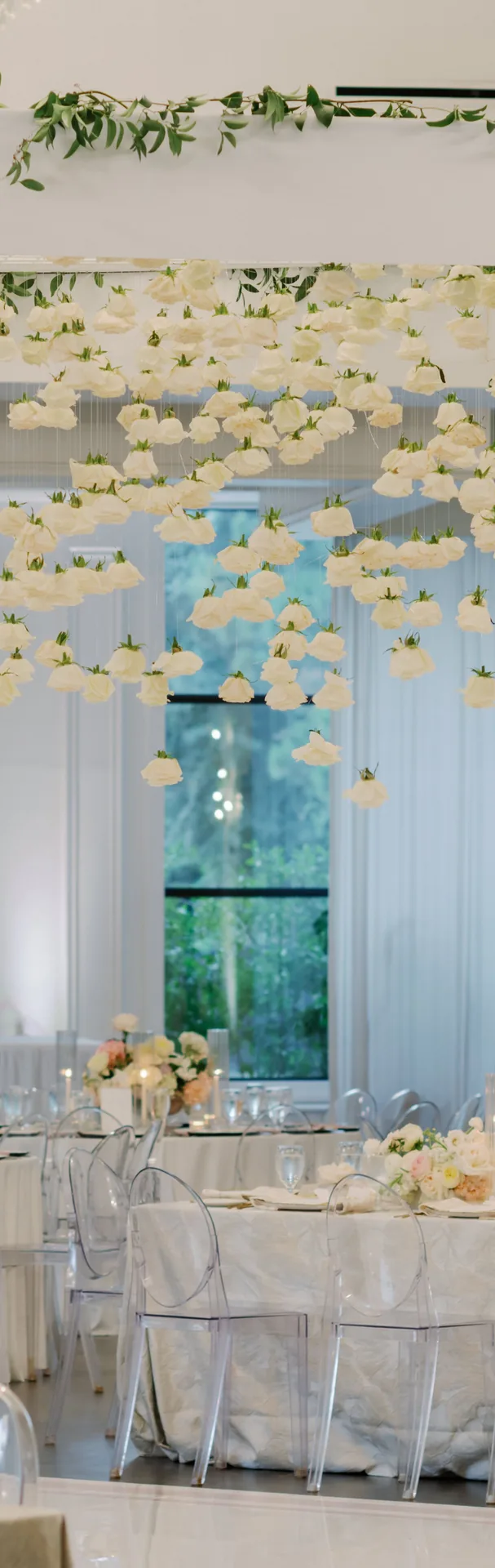 Cascading white hanging florals over a reception